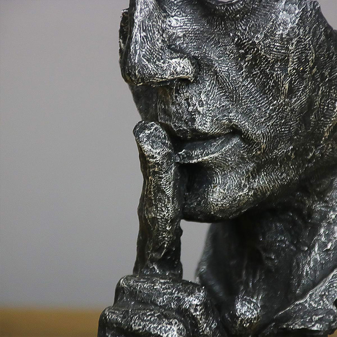 Black abstract resin shush face sculpture with an antique bronze finish and fractured texture. — view 4