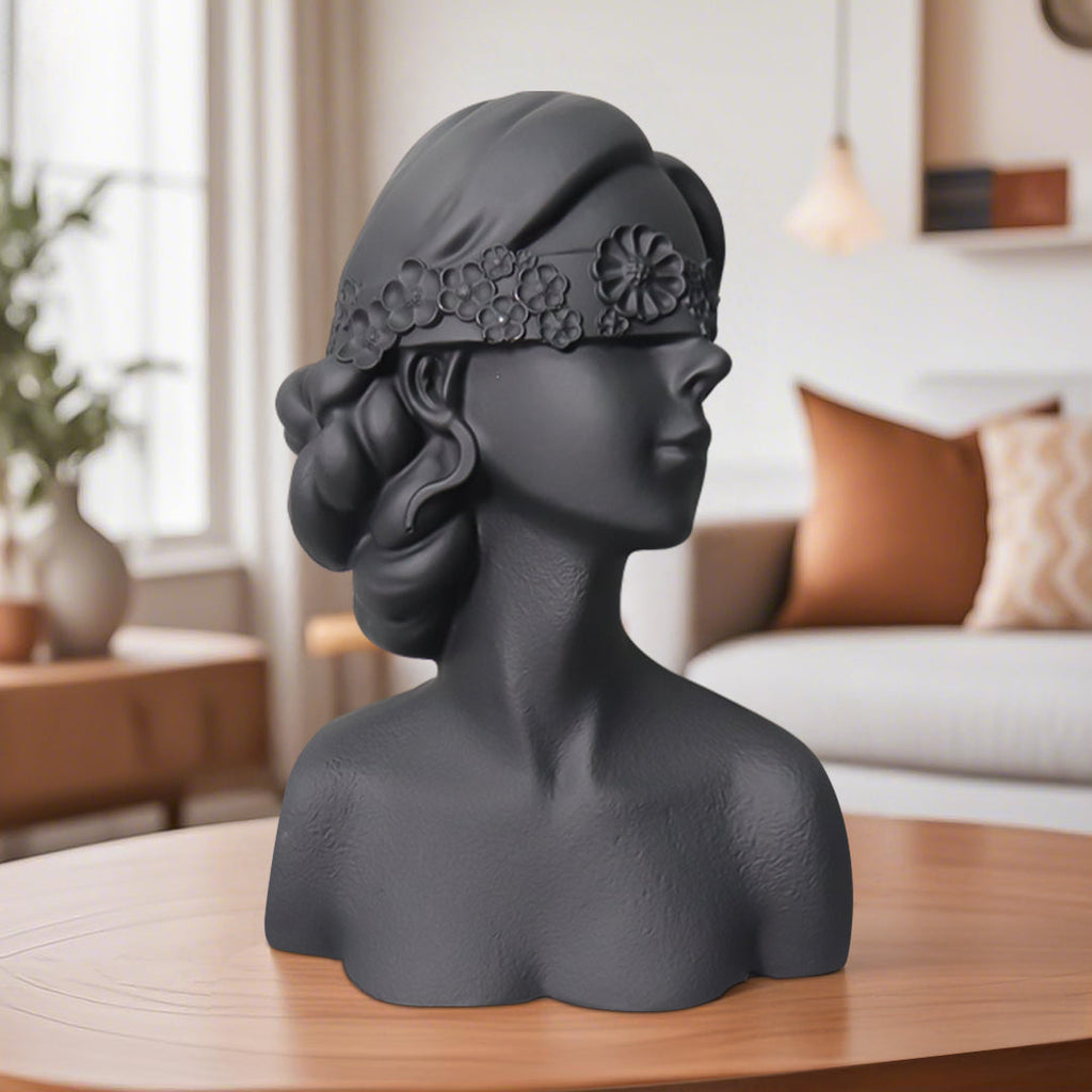 Matte black resin bust sculpture of a blindfolded lady with delicate floral crown detailing. — view 4