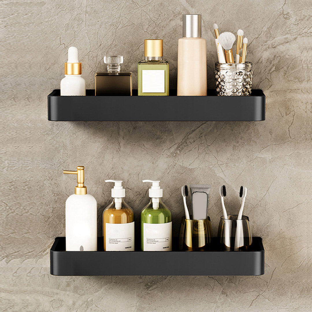 Black wall-mounted aluminum spice rack holding kitchen condiments and jars on a smooth tile wall. — view 5