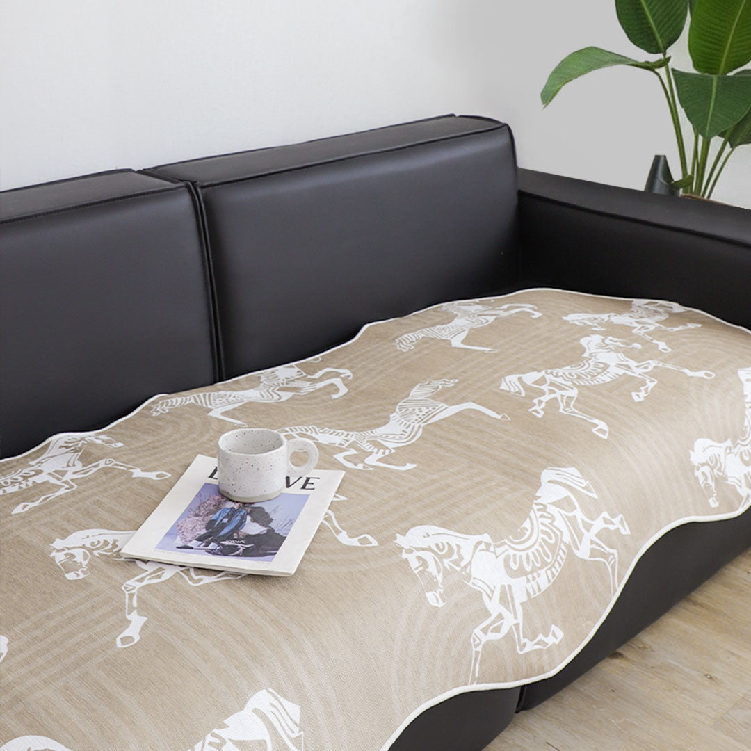 Beige two-seater sofa cover with black horse print draped elegantly over a couch — view 5