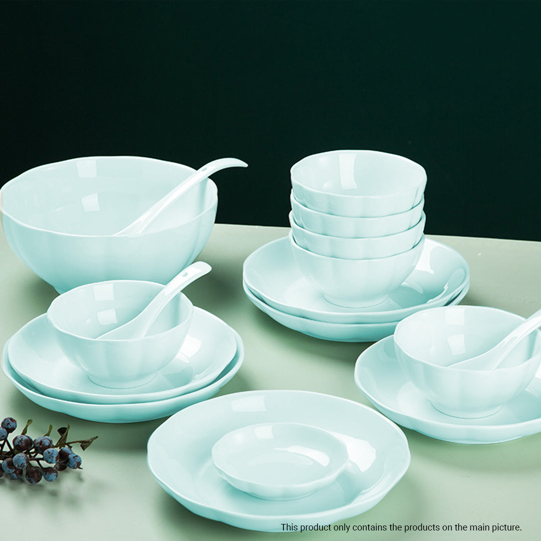 Light blue Japanese style ceramic dinnerware set with bowls plates and chopsticks on a table — view 5