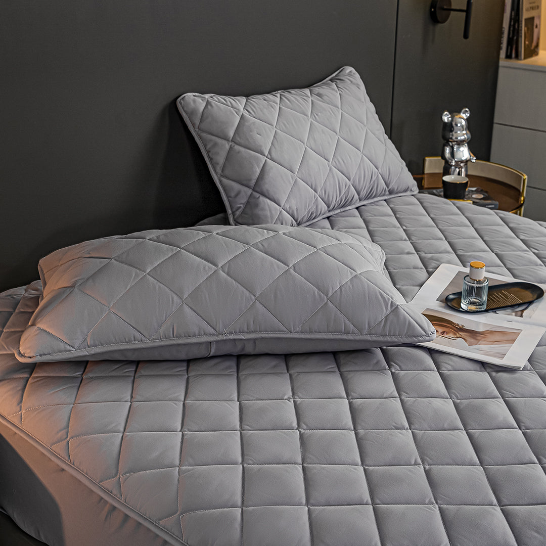 Grey cross-hatch quilted mattress cover and two matching pillow covers crafted from premium soft polyester. — view 5
