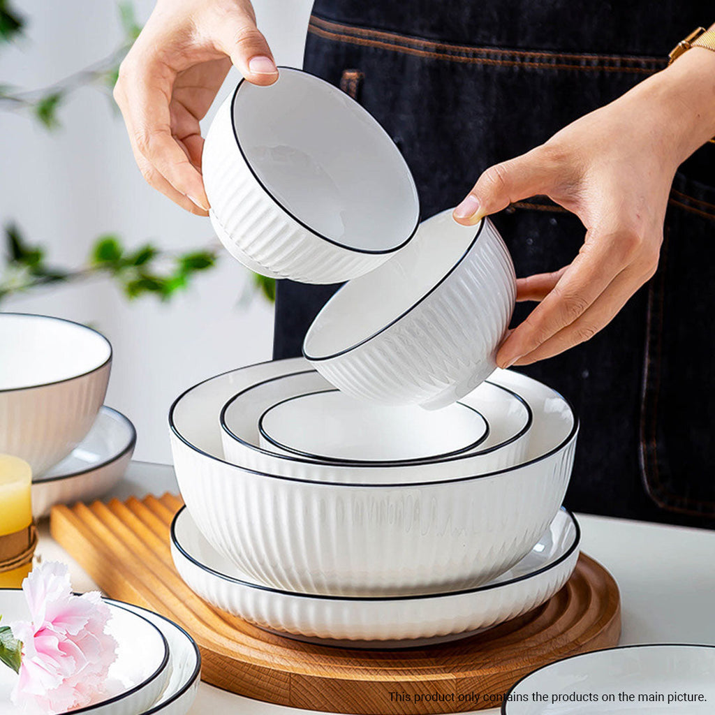 White minimalist ceramic dinnerware set including soup bowls, plates, spoons, and chopsticks — view 5