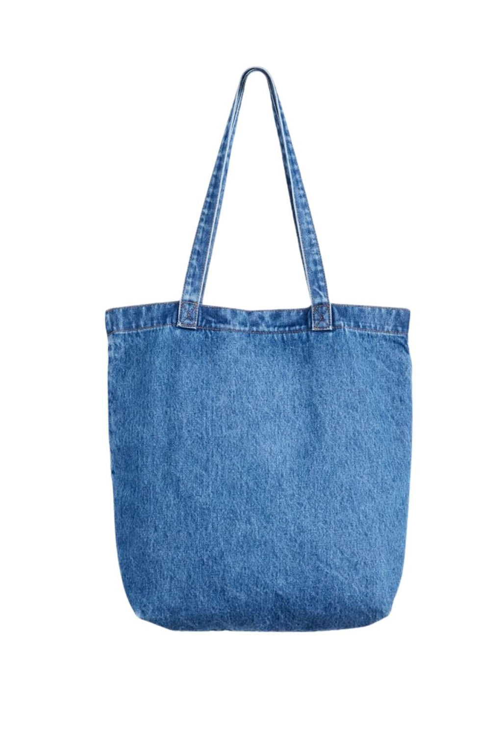 Beige denim tote bag with double handles, snap fastening, front pocket, and red signature label — view 3