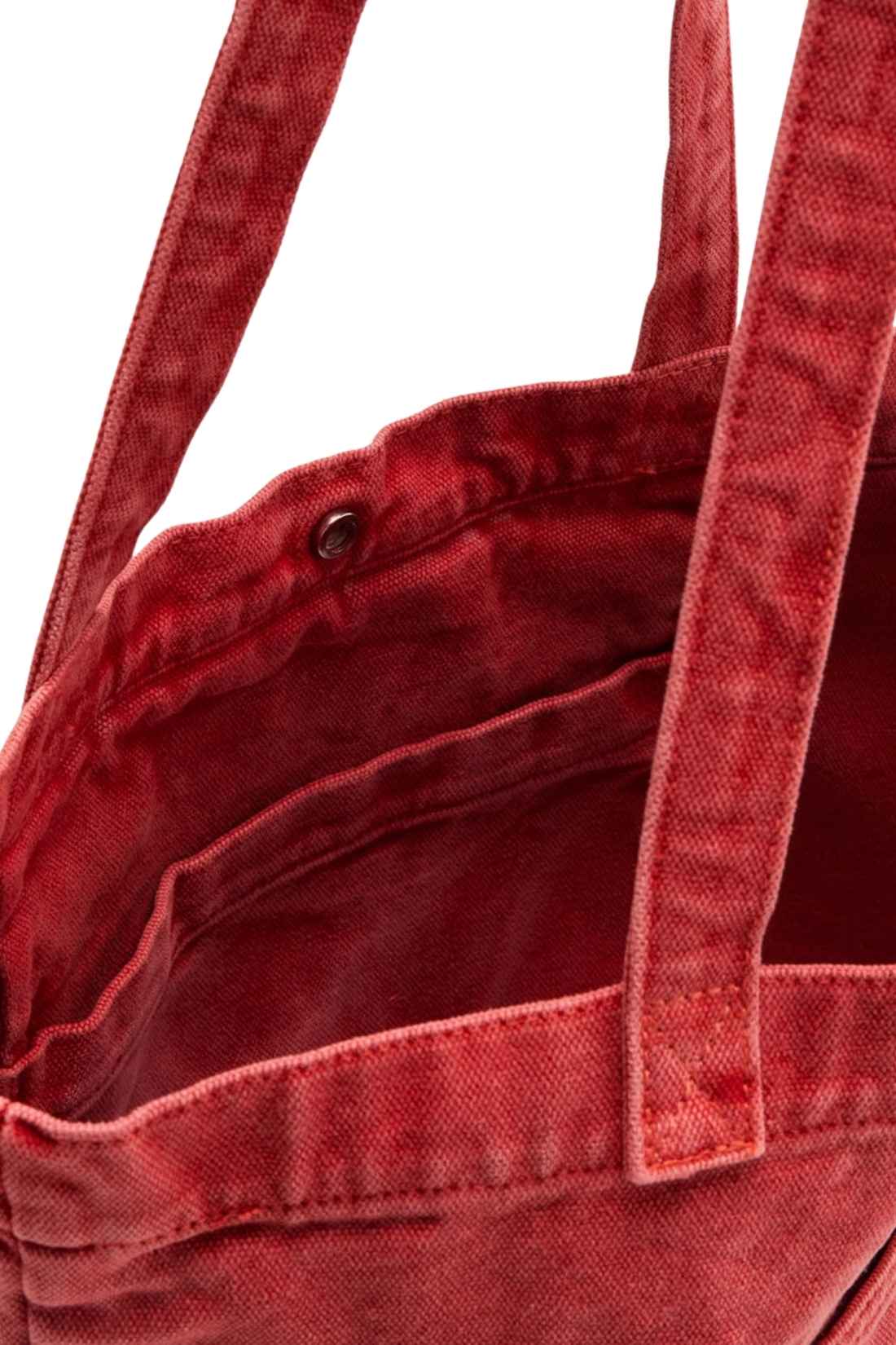 Beige denim tote bag with double handles, snap fastening, front pocket, and red signature label — view 20