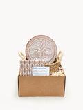 Terracotta tree of life bread warmer stone with woven seagrass basket and printed cotton tea towel