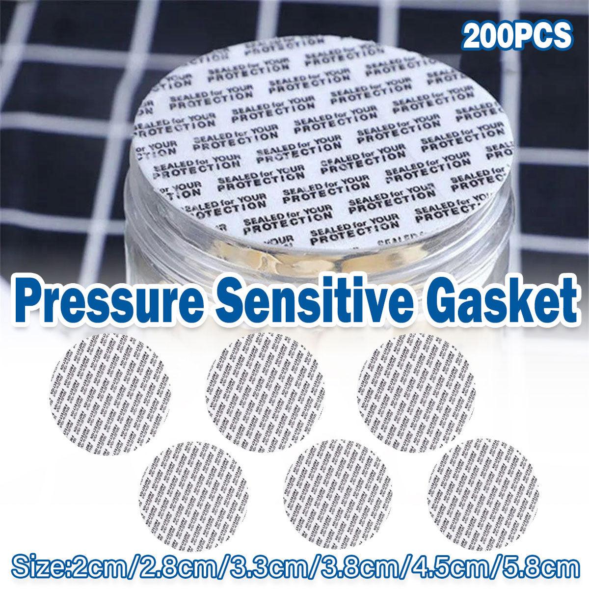 White pressure-sensitive foam bottle cap liners arranged in a neat pile for jar sealing