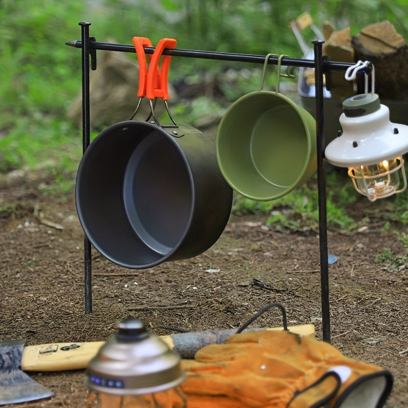 Ultra-light aluminum camping cookware set featuring orange accents, pots, pans, and a matching kettle. — view 5