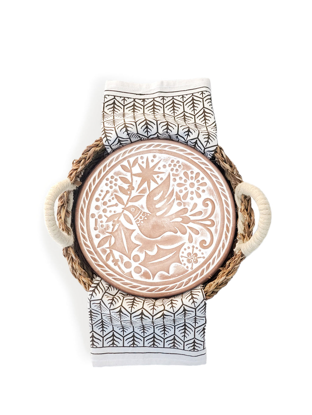 Round terracotta bread warmer with bird engraving inside a natural seagrass basket and cotton tea towel — view 5