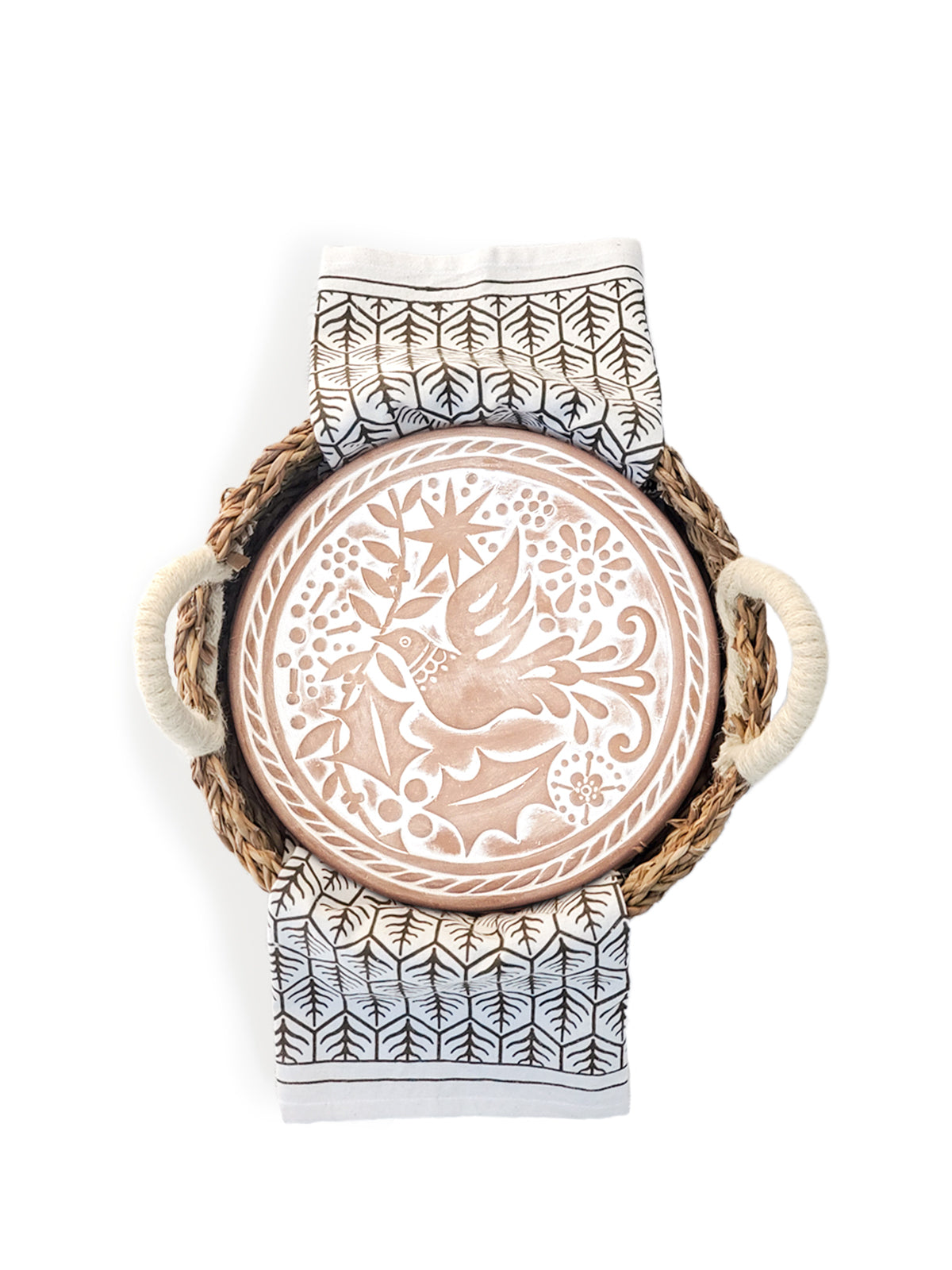 Round terracotta bread warmer with bird engraving inside a natural seagrass basket and cotton tea towel — view 5