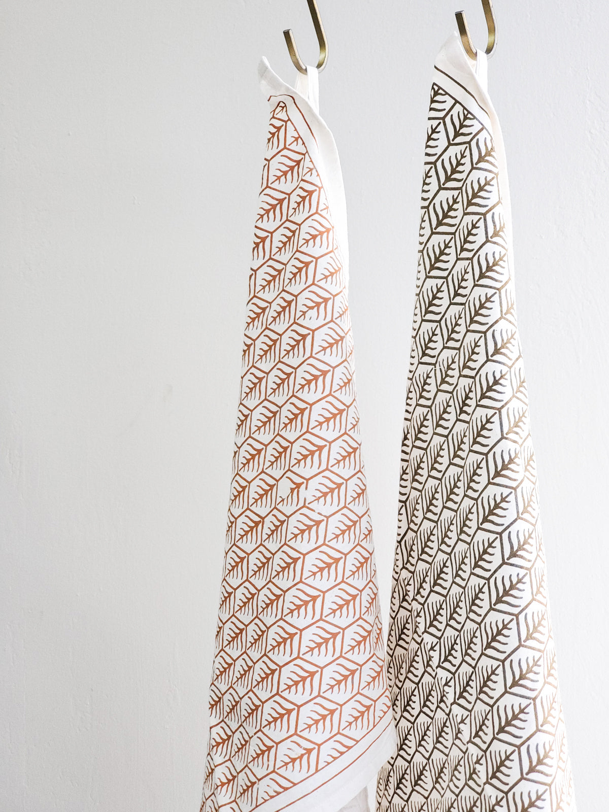 Hand screen-printed tea towel in natural white cotton with brown earthy artisan design patterns — view 4