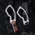 Titanium alloy keychain with genuine leather accents and sleek side-push locking mechanism