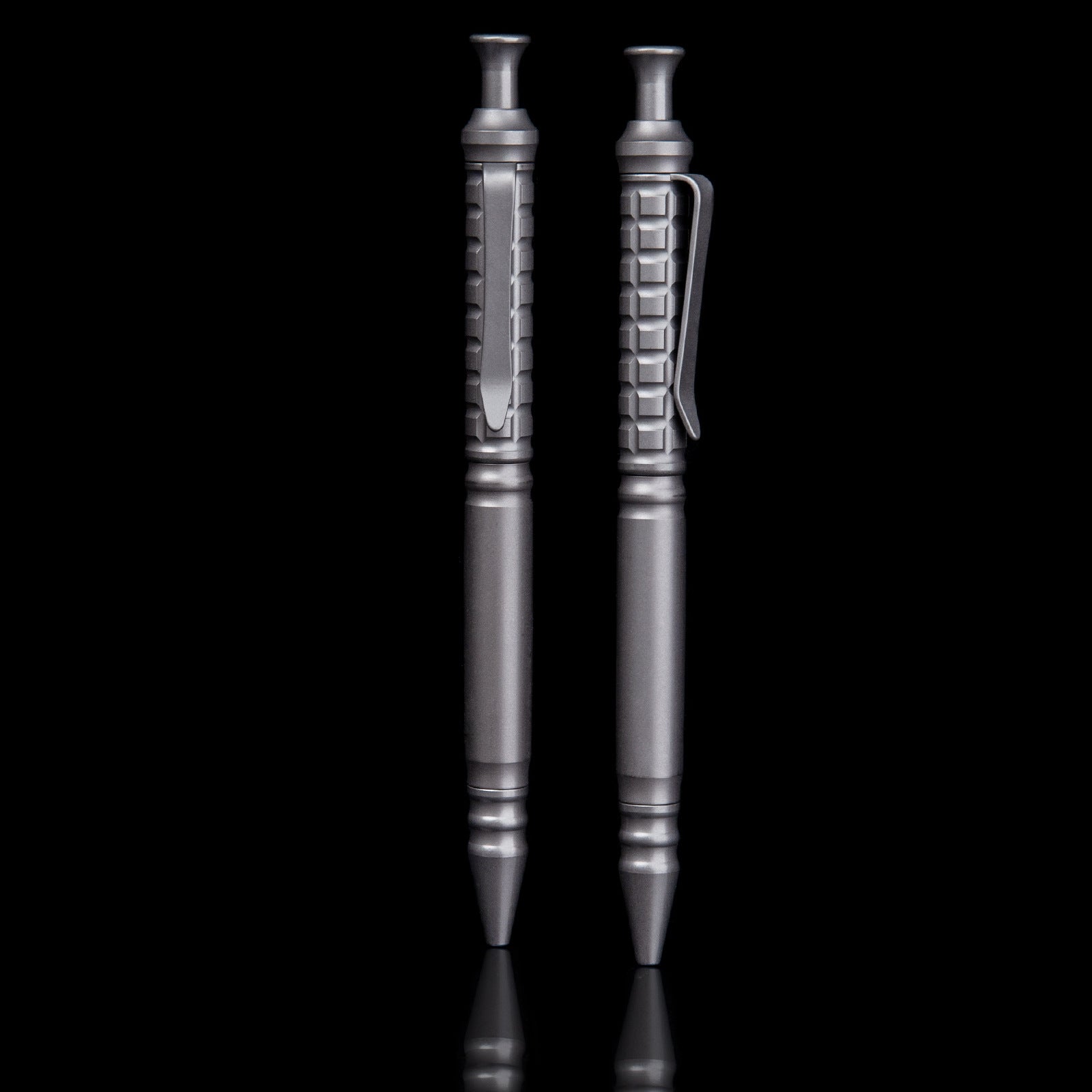 Compact titanium tactical pen with pocket clip and textured anti-slip grip for everyday carry — view 2