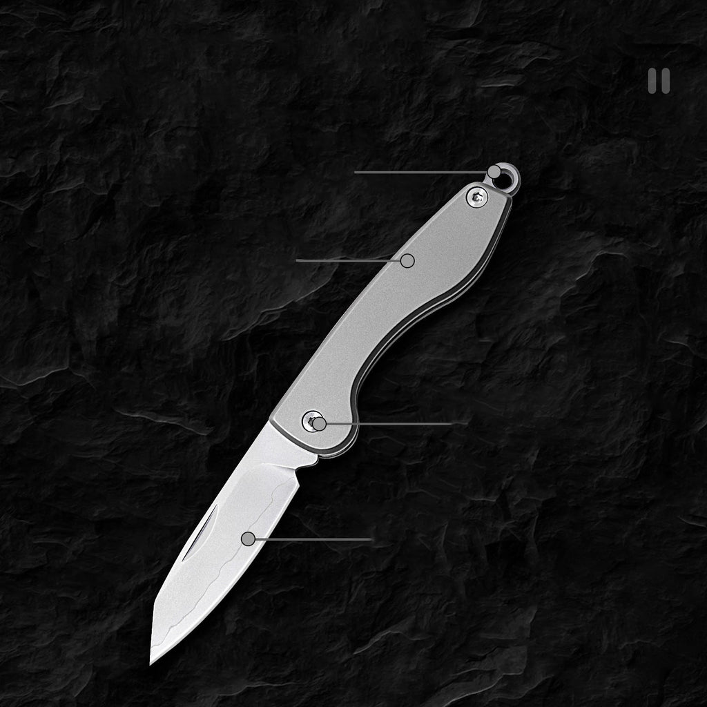 Mini folding titanium utility knife with a razor-sharp stainless steel blade and compact keychain loop — view 3