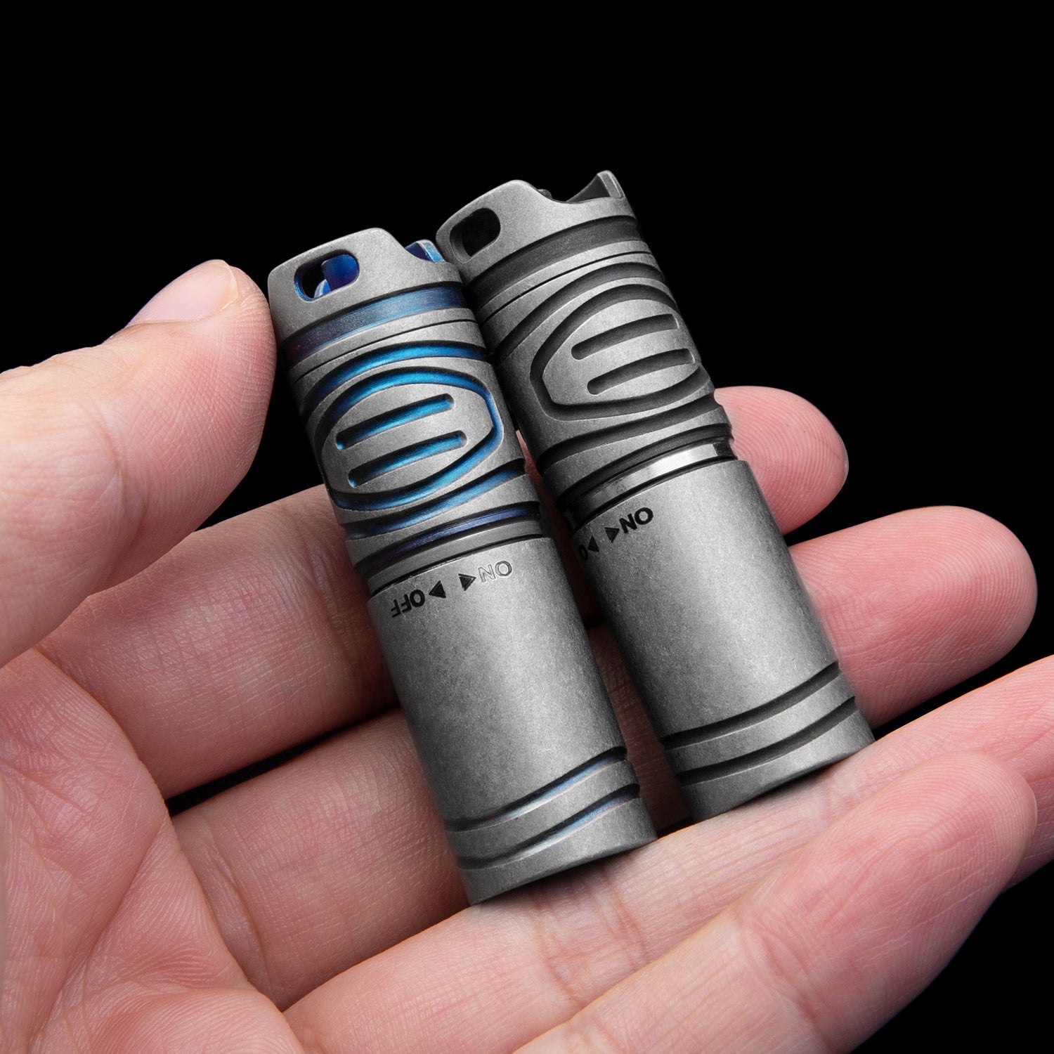 Titanium EDC flashlight, compact silver handheld LED torch for outdoor camping and everyday carry.