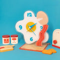 Egg shaped acrylic desktop clock displaying time on a modern home office desk surface