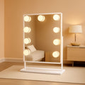 Lighted 12x10 tabletop vanity mirror with 9 LED bulbs, aluminum frame, and 10x magnifying attachment