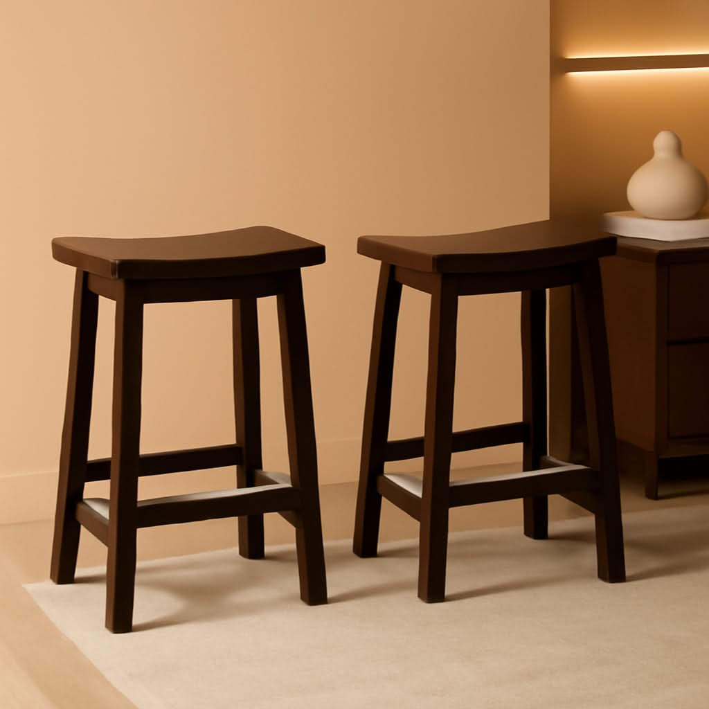 Set of two solid wood saddle seat counter stools in a rich dark walnut finish