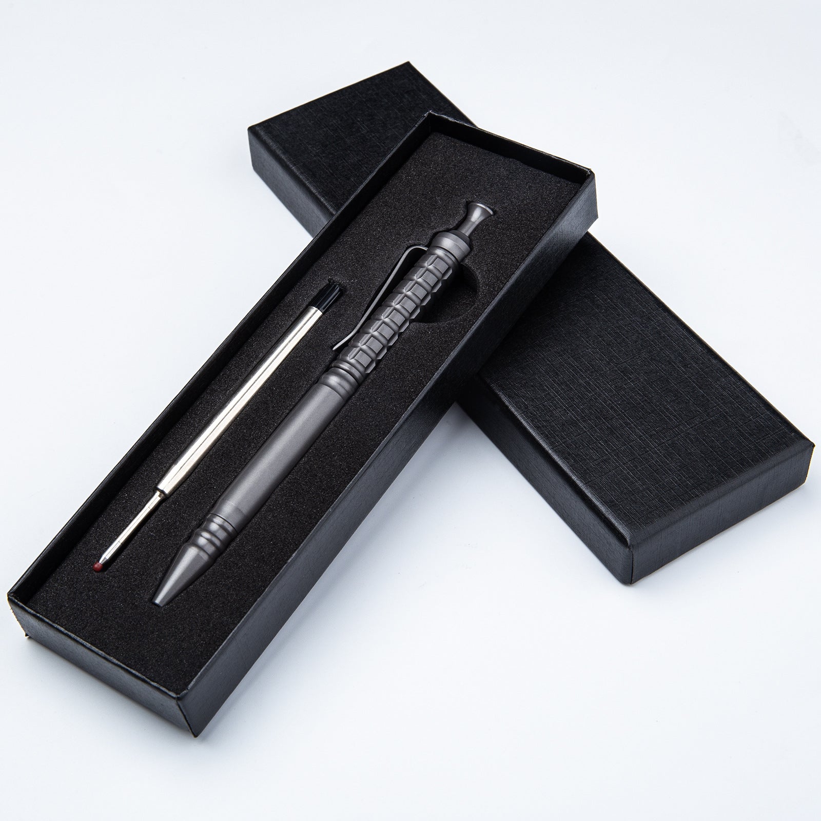 Compact titanium tactical pen with pocket clip and textured anti-slip grip for everyday carry — view 4