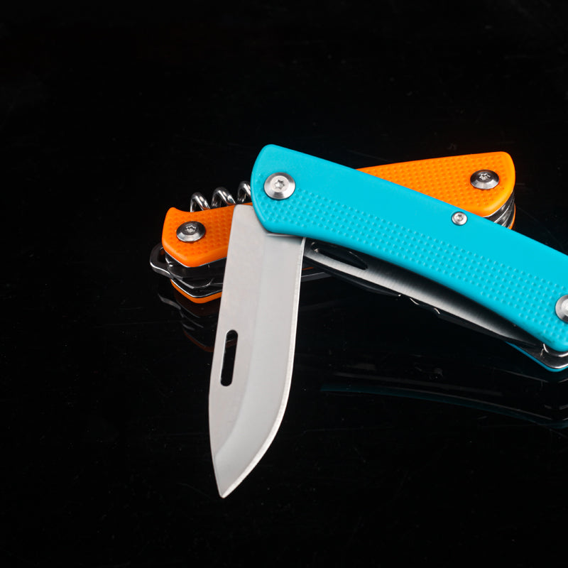 7-in-1 stainless steel pocket knife multitool with black plastic handle and multiple deployed utility blades — view 4