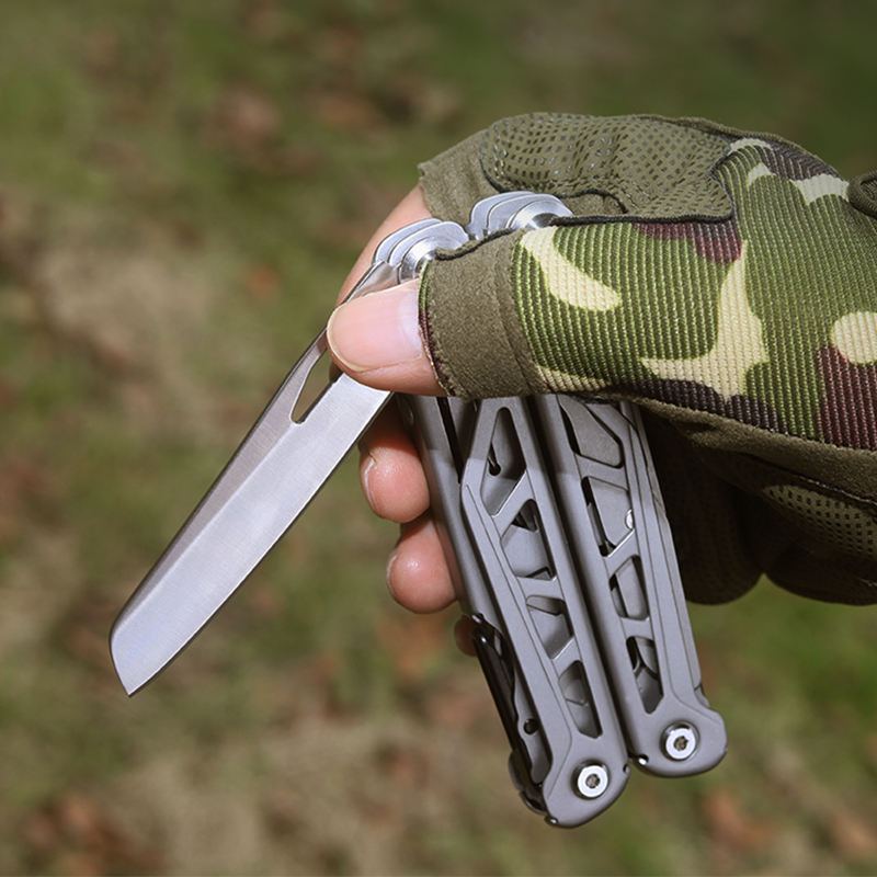 Stainless steel foldable multitool with open pliers scissors screwdriver and saw on a white background — view 5