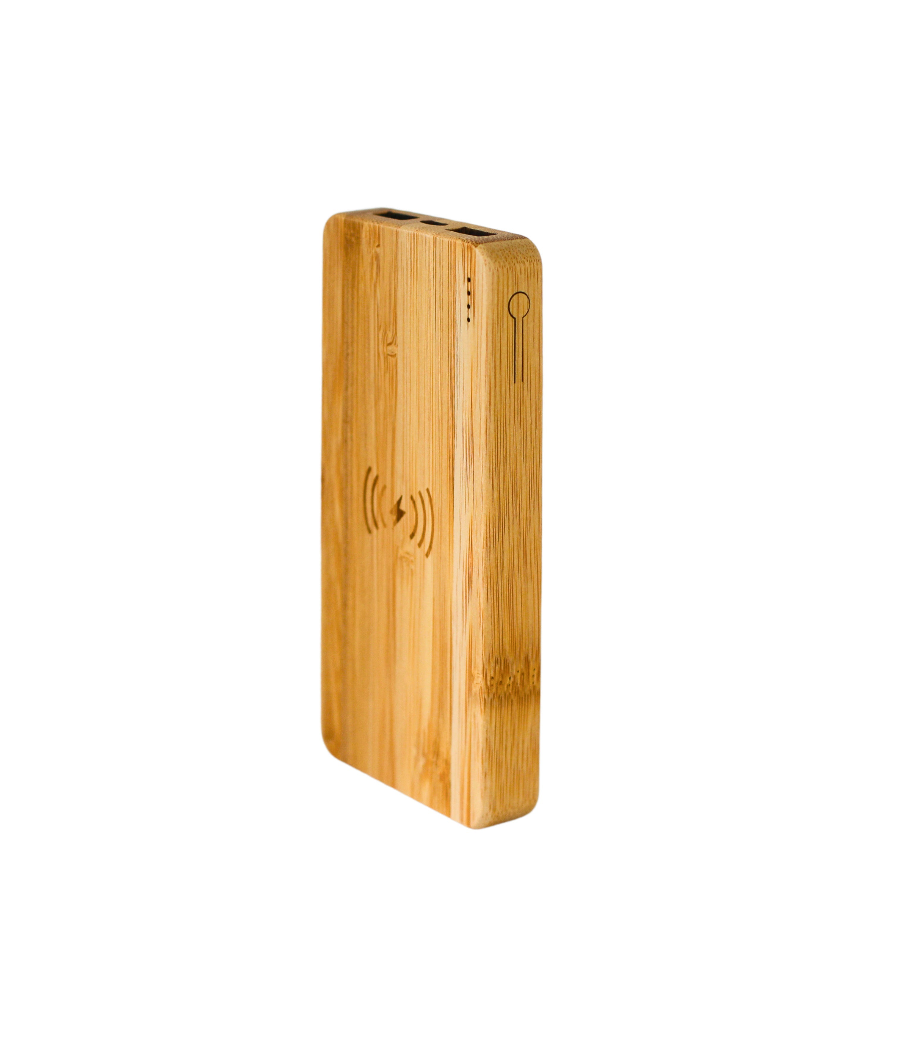 Rectangular bamboo wireless charger power bank resting on a sleek modern desktop workspace — view 2
