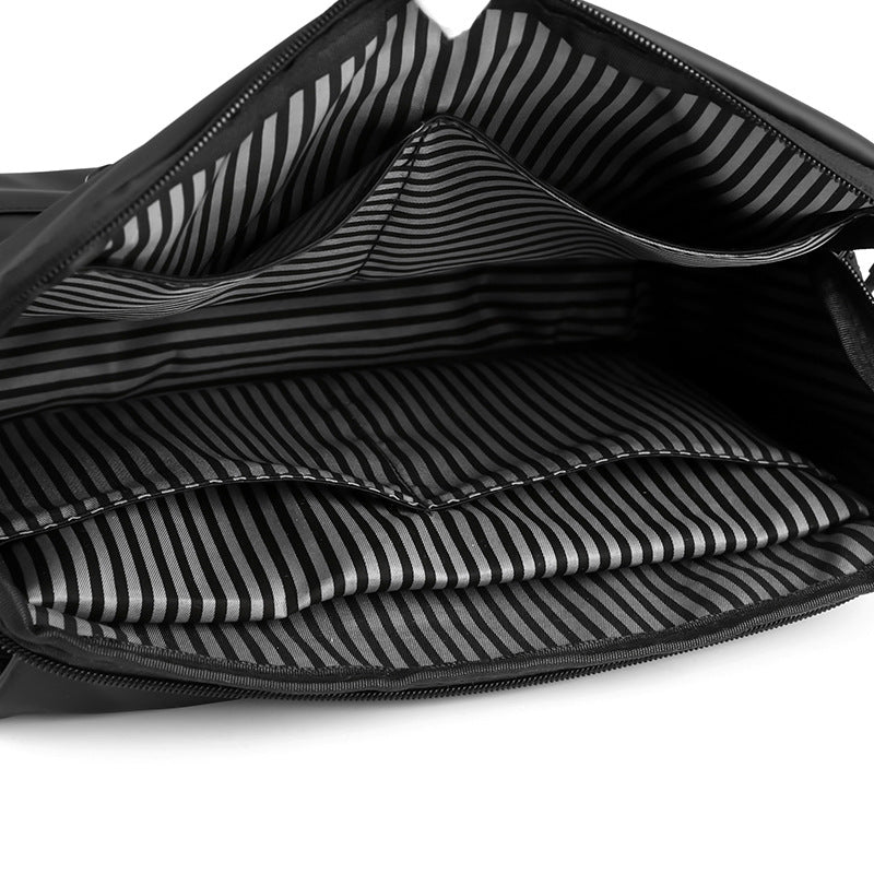 Black water-resistant minimalist men's messenger bag with adjustable shoulder strap and sleek flap design. — view 5