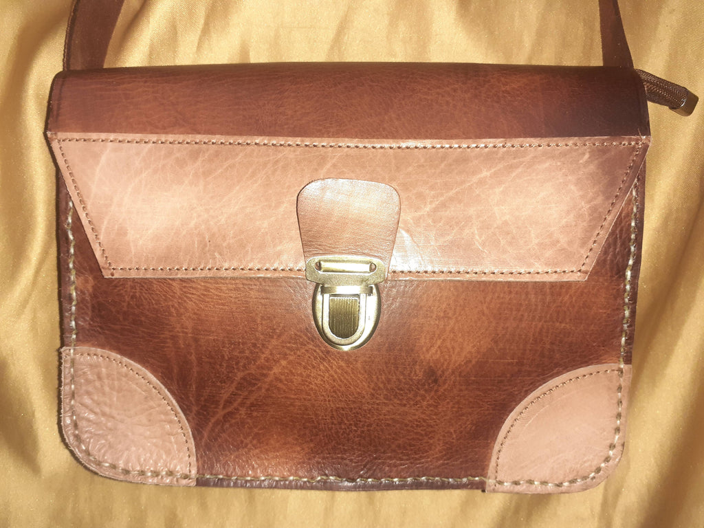 Two-tone leather crossbody bag with rustic finish, front zipper pocket, and long adjustable shoulder strap — view 6
