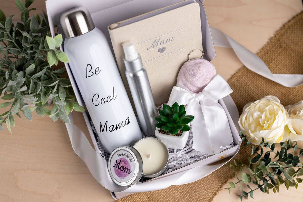 Mom care package gift box with water bottle, socks, scented candle, notebook, and succulent plant
