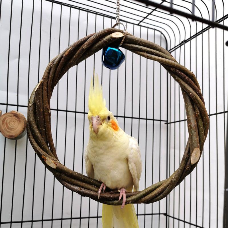 Natural apple branch bird chewing toy rattan braided ring attached to a bird cage wire