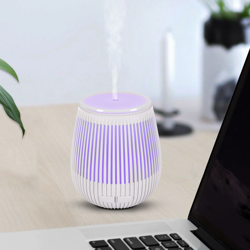 Vase-shaped USB ultrasonic aroma diffuser and humidifier in sleek minimalist black and white design.