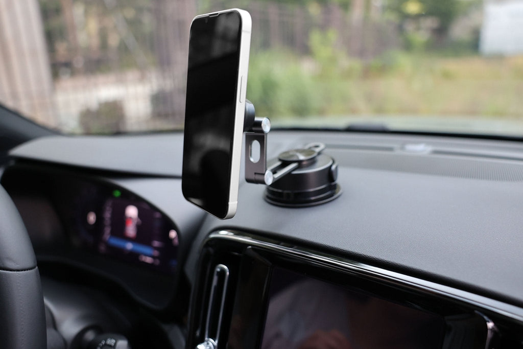Dashboard base for foldaway car mount in black with 3M adhesive pad and removal handle — view 3