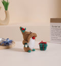 Christmas Gnome crochet kit with brown hat, amigurumi crafting supplies, yarn, and small handmade gift.