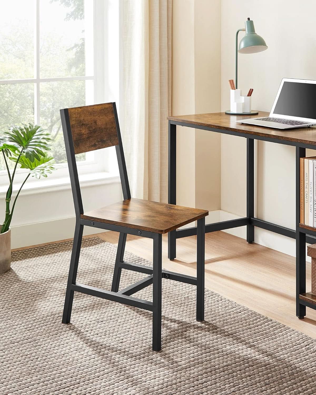 Four rustic brown wooden dining chairs with black industrial metal frames and ergonomic angled backrests — view 4