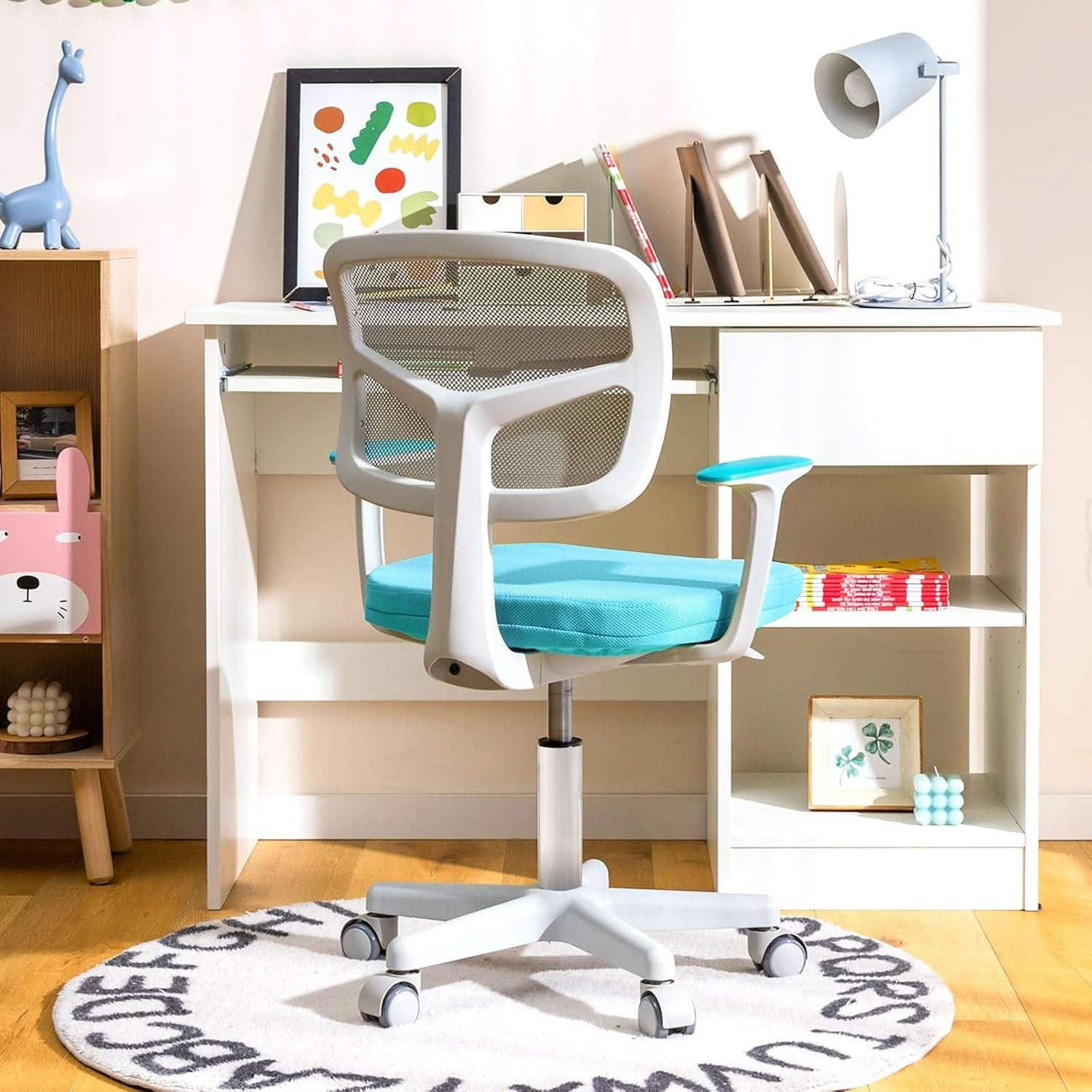 Cyan ergonomic kids desk chair with breathable mesh back, padded armrests, and rolling casters — view 5