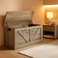 Grey wooden entryway storage bench with open lid revealing large interior compartment