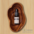 Bottle of 1000mg broad spectrum CBD oil drops with glass dropper on white background