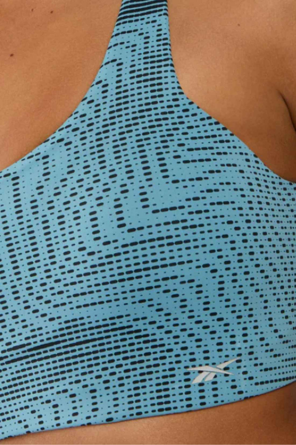 Light blue patterned nylon women's running sports bra with adjustable straps and rowing style back — view 6