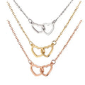 Double heart name necklace in stainless steel featuring interlocking customizable pendants on a delicate chain.