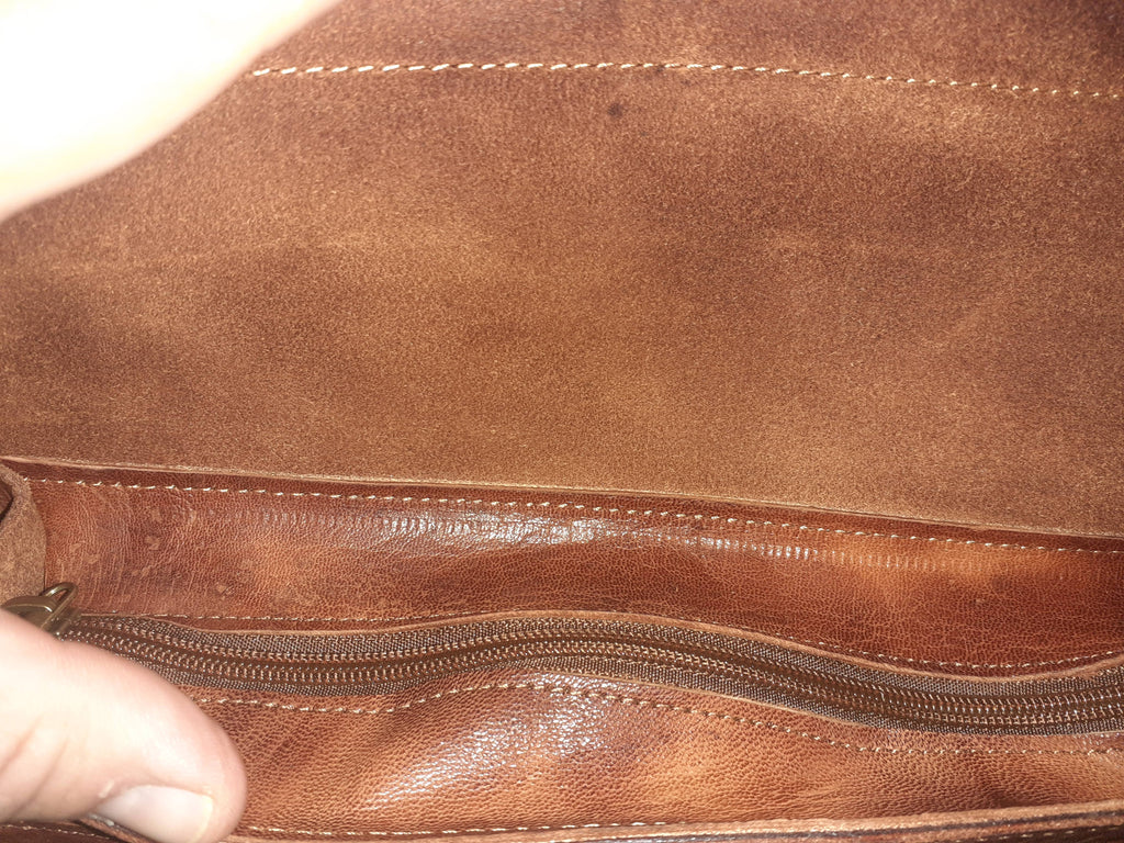 Two-tone leather crossbody bag with rustic finish, front zipper pocket, and long adjustable shoulder strap — view 8