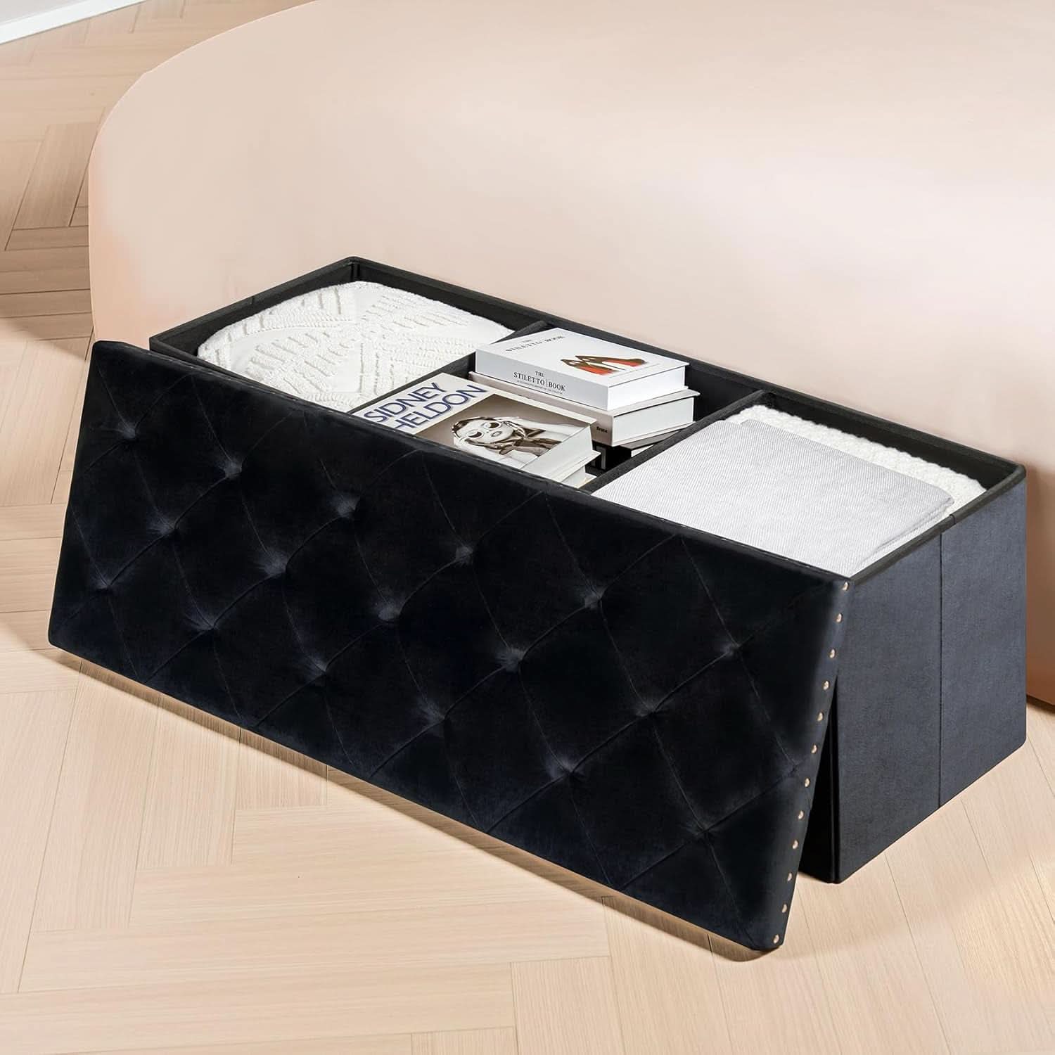 Black velvet storage ottoman bench with plush cushion, open to show hidden interior compartment space — view 4
