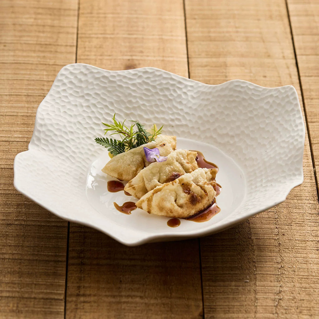 Irregular matte square plate in off white high fired ceramic with lattice surface — view 3