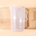 Large 2000ml clear measuring cup with graduation marks and pouring spout for baking and crafting