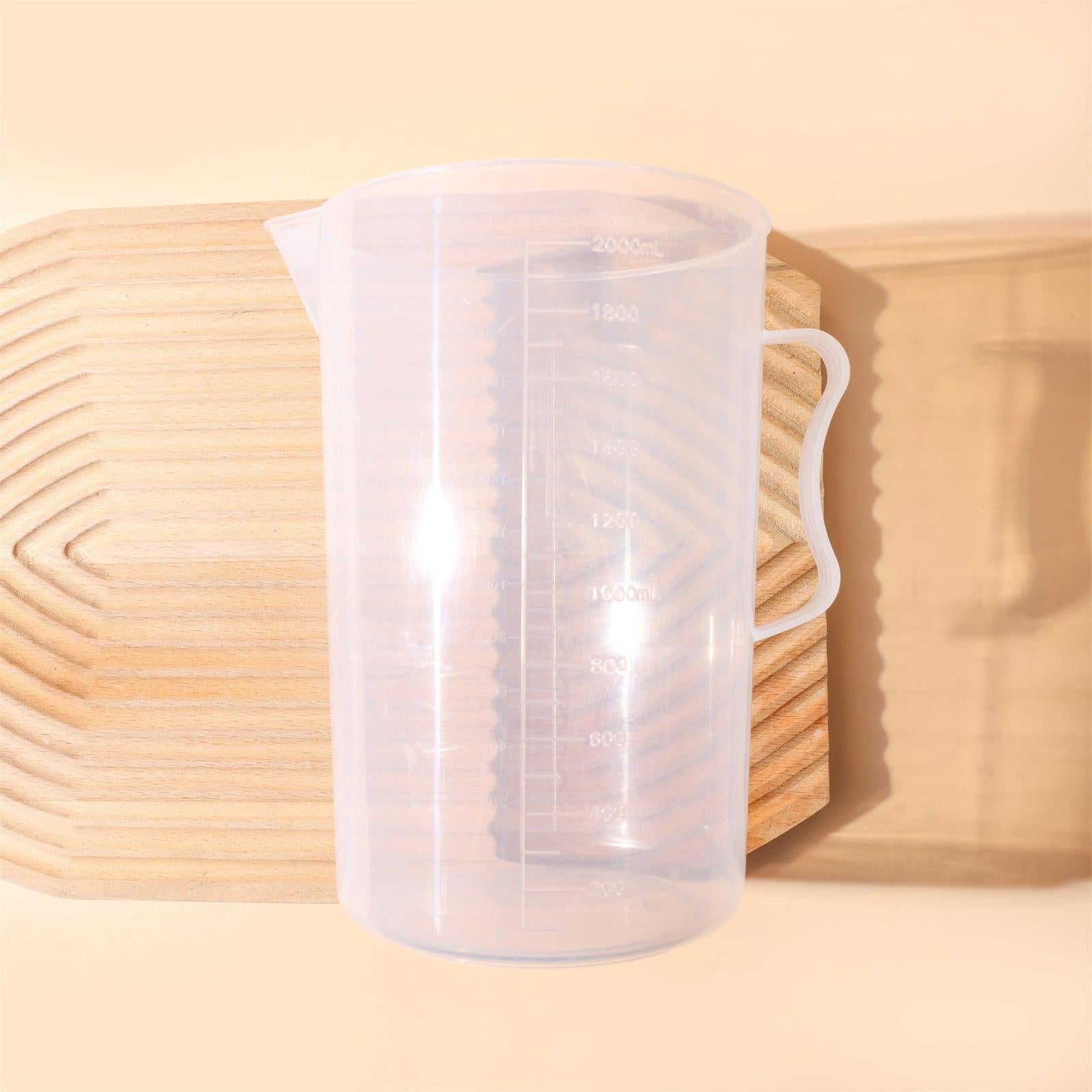 Large 2000ml clear measuring cup with graduation marks and pouring spout for baking and crafting