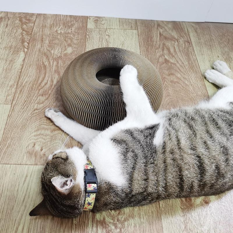 Magic Claw Haven foldable cat scratcher made of corrugated paper with an included play bell