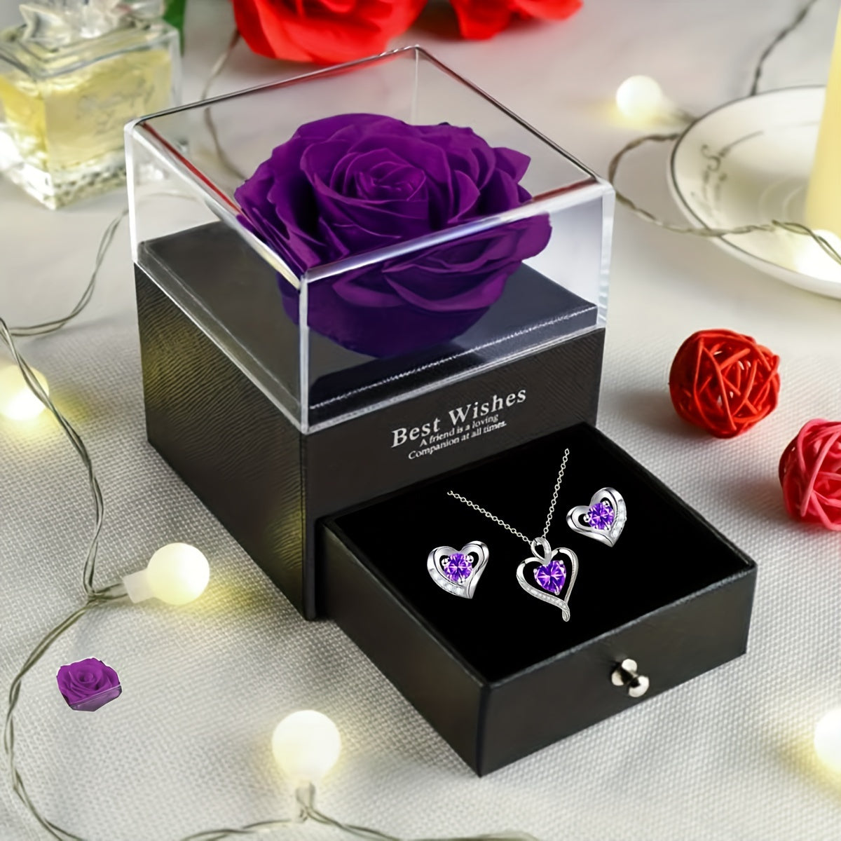 Elegant heart-shaped jewelry set featuring a necklace and earrings with purple cubic zirconia gemstones — view 2