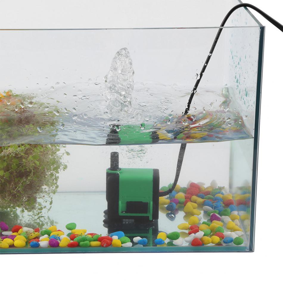 Silentflow submersible fish tank water pump in green and black plastic with bottom suction cups