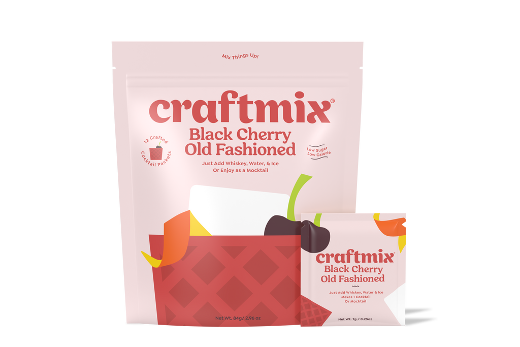 Black cherry old fashioned cocktail mix packet with a dark red drink over ice — view 4