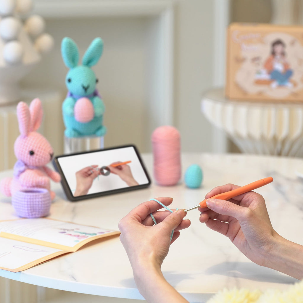Rabbit amigurumi crochet kit showing finished plush bunny, premium threads, hook, and instructions — view 5
