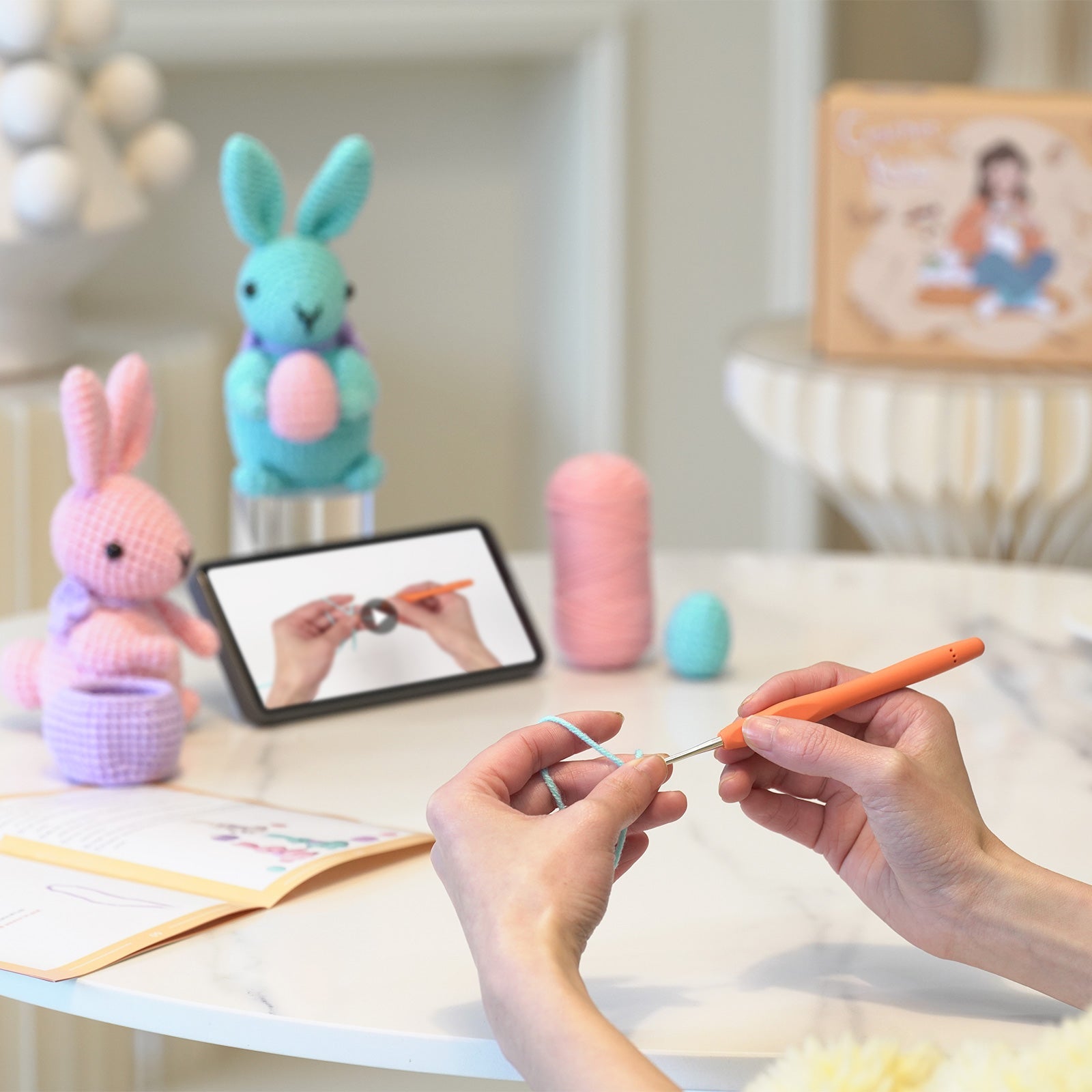 Rabbit amigurumi crochet kit showing finished plush bunny, premium threads, hook, and instructions — view 5